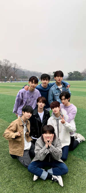 A Group Of Young Men Posing For A Photo Wallpaper