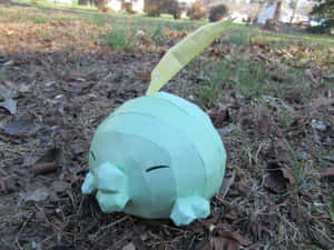 A Gulpin Toy In The Ground Wallpaper