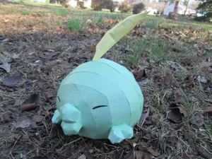 A Gulpin Toy In The Ground Wallpaper