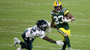 A Happy Aaron Jones Of The Green Bay Packers Wallpaper