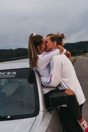 A Happy Couple Enjoying A Lovely Day Outdoors. Wallpaper