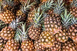 A Heap Of Ripe Pineapple Perfect For Enjoying Wallpaper