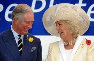 A Heartwarming Moment Of Camilla Laughing With Charles Wallpaper