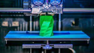 A High-quality Image Of A 3d Printer In Action, Creating A Complex Object Layer By Layer. Wallpaper