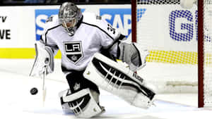 A Hockey Goalie Is Ready To Block A Shot Wallpaper