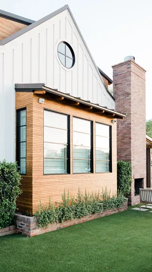 A House With A Lawn And A Bench Wallpaper