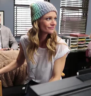 A.j. Cook Posing In A Stylish Outfit Wallpaper