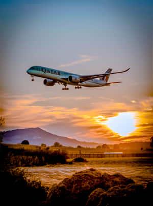 A Jet Plane Flying Over A Field Wallpaper