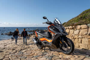 A Kymco Motor Scooter Parked Outdoors Wallpaper