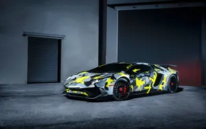 A Lamborghini Huracan Is Parked In A Garage Wallpaper