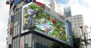 A Large Billboard With A Cartoon Character On It Wallpaper