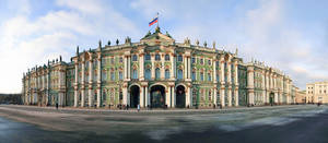 A Large Building With A Clock Tower In The Middle Wallpaper