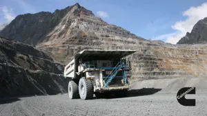 A Large Truck Driving Through A Mine Wallpaper