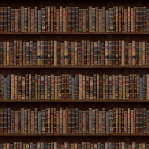 A Library With Many Books On Shelves Wallpaper