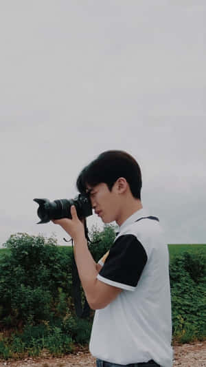 A Loving Couple Enjoying Their Time Together Outdoors Wallpaper