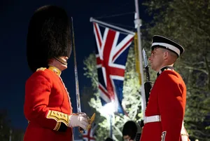 A Luxurious Red Coat In Winter Snow Wallpaper
