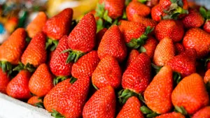 A Magical Landscape In The Evening With Bright Stars And A Glowing Blue Lake Wallpaper