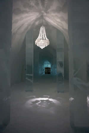 A Magnificent Ice Hotel Room, Decorated With Intricate Ice Sculptures And Illuminated By A Soft Blue Light. Wallpaper