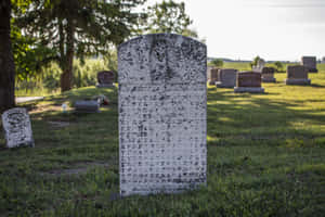 A Majestic Gravestone Against A Striking Sky Wallpaper