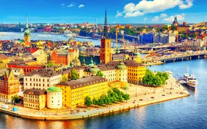 A Majestic Sunrise Over Linköping Cityscape Wallpaper