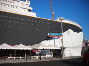A Majestic View Of The Rms Titanic Museum With Canopy Tents. Wallpaper