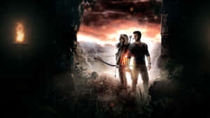 A Man And Woman Standing In A Dark Cave Wallpaper