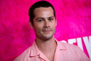 A Man In A Pink Shirt Is Posing For A Photo Wallpaper