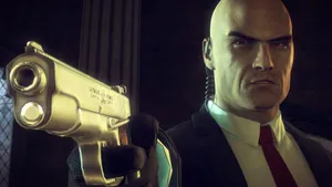 A Man In A Suit Holding A Gun Wallpaper