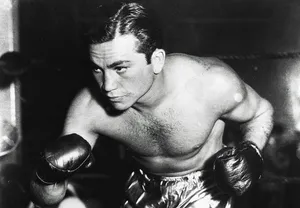 A Man In Boxing Gloves Is Posing For A Photo Wallpaper