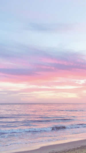 A Man Is Riding A Bike On A Beach Wallpaper