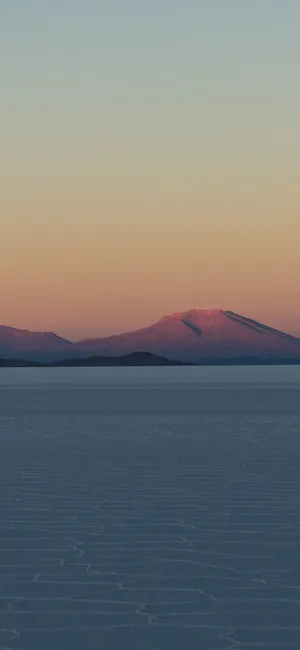 A Man Is Riding A Horse On A Frozen Lake Wallpaper