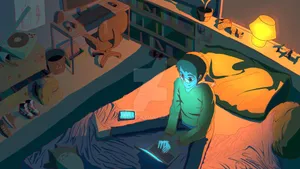 A Man Is Sitting On A Bed With A Laptop Wallpaper