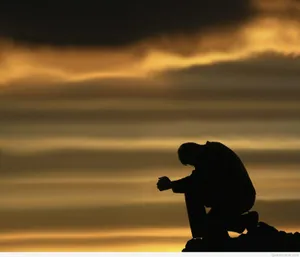 A Man Kneeling Down Wallpaper