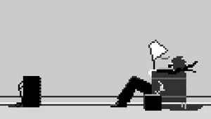 A Man Sitting On A Chair With A Laptop Wallpaper