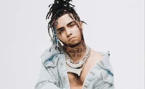 A Man With Dreadlocks And A Necklace Wallpaper