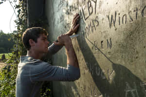 A Man Writing On A Wall Wallpaper