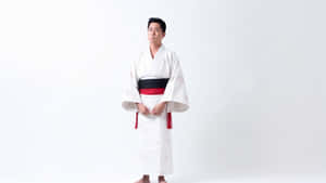 A Martial Artist Displaying Dedication And Discipline In Their Uniform. Wallpaper