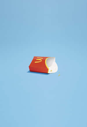 A Mcdonald's Bag On A Blue Surface Wallpaper