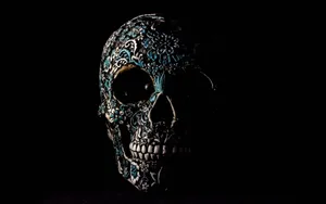 A Menacing Skull Made Of Black Stone Wallpaper