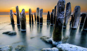 A Mesmerizing View Of A Frozen Lake On A Winter Day Wallpaper