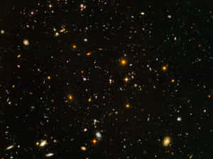 A Mesmerizing View Of Deep Space Featuring Countless Vibrant Stars And Galaxies Wallpaper