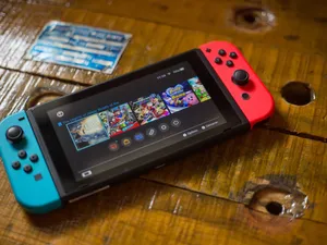 A Modern Gaming Console Collection With Controllers Wallpaper