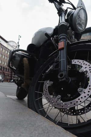 A Motorcycle Parked On The Side Of The Road Wallpaper