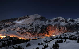 A Mountain Covered In Snow Wallpaper