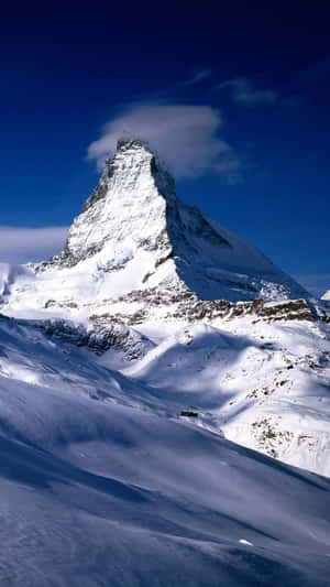 A Mountain Covered In Snow With A Cloud In The Sky Wallpaper