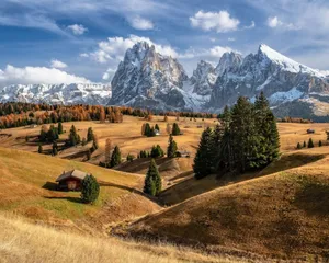 A Mountain Landscape With A House And Trees Wallpaper