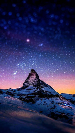 A Mountain With Stars And Snow Under The Night Sky Wallpaper