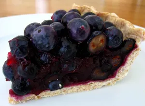 A Mouth-watering Blueberry Pie, Freshly Baked And Still Steaming Hot Wallpaper