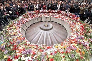 A Moving Tribute - Visitors At The Armenian Genocide Memorial Wallpaper