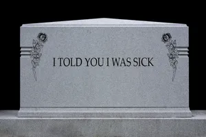 A Mysterious Gravestone Surrounded By Nature Wallpaper